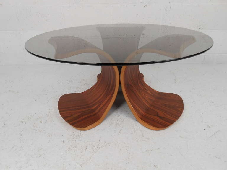Uniquely shaped bentwood base with smoke glass top. Please confirm item location (NY or NJ) with dealer.
 