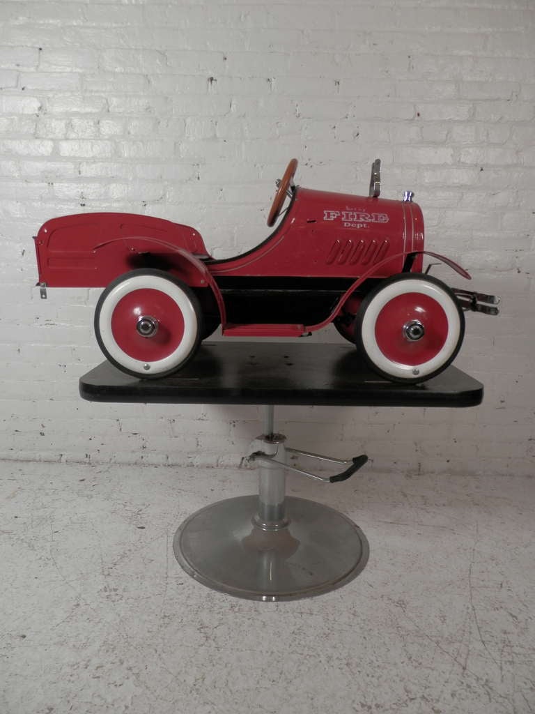 Unique metal fire engine made for barbers to easily cut children's hair. Fully detailed with white lettering, chrome trim, white wall tires, and more. 

(Please confirm item location - NY or NJ - with dealer)