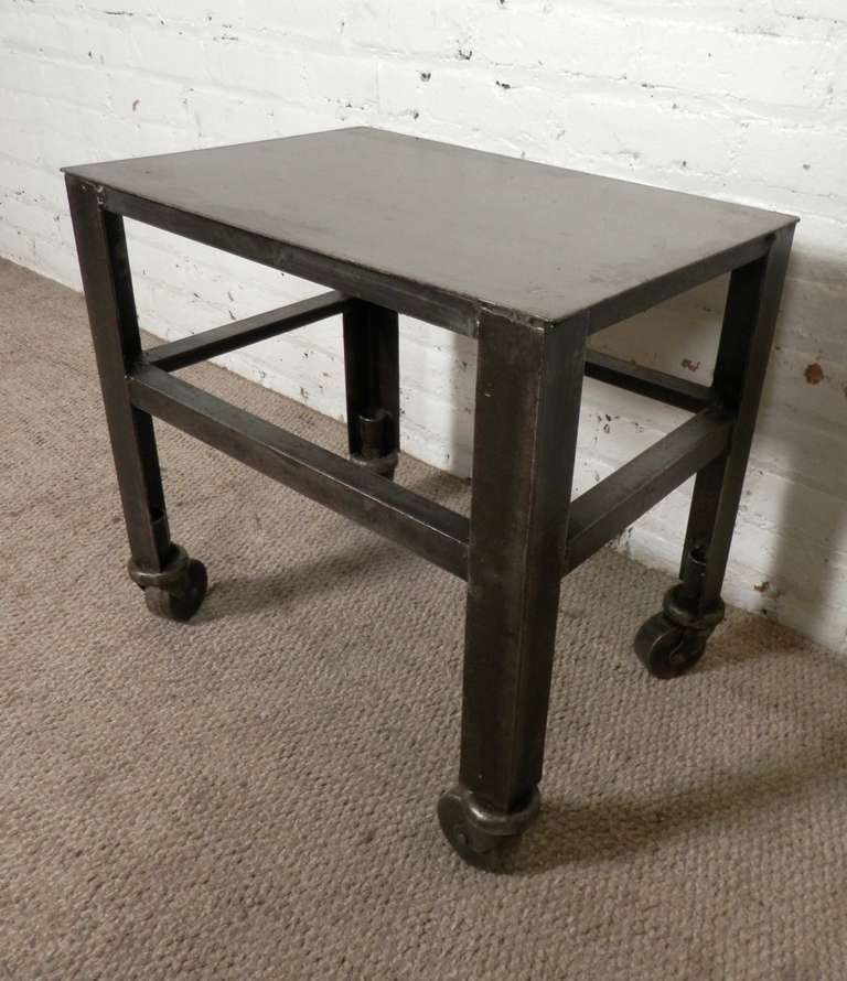 Factory table newly refinished for purpose in a modern home. Set on casters for easy mobility. 

(Please confirm item location - NY or NJ - with dealer)