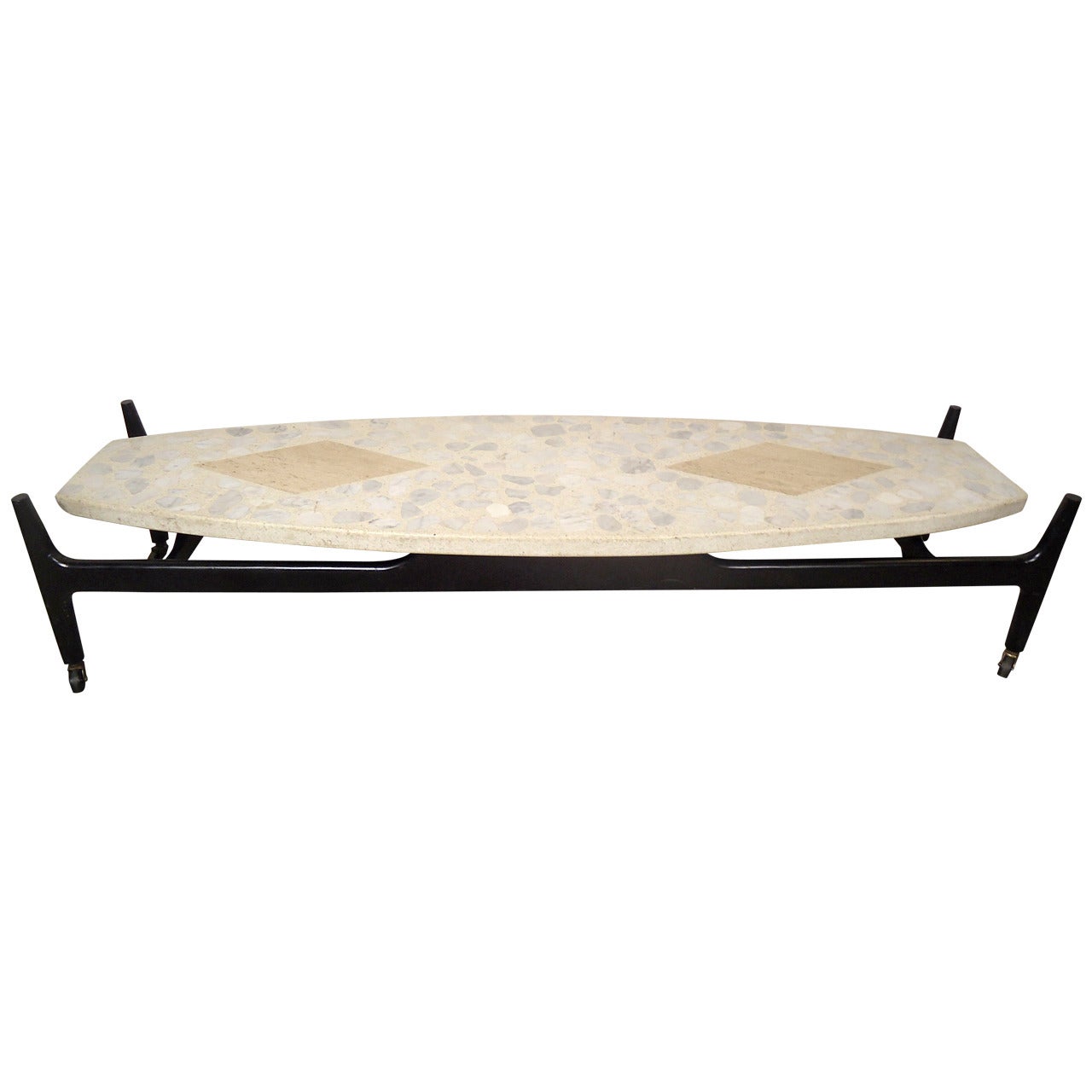 Mid-century modern cocktail table. Thick terrazzo top with diamond inlays set on a black wood base on casters. Attractive Sixties surfboard shape, makes for a great coffee table.

(Please confirm item location - NY or NJ - with dealer)