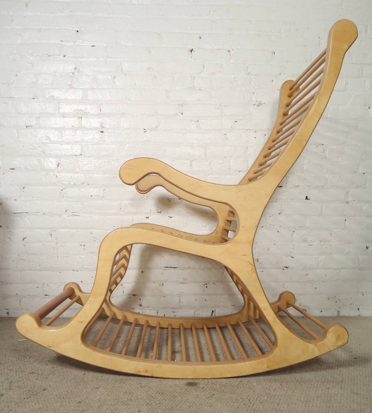 Very large laminated wood rocker with sculpted detailing. Body is made of pressed wood with long dowels comprising the entire seat and back. A great conversation piece!

(Please confirm item location - NY or NJ - with dealer)