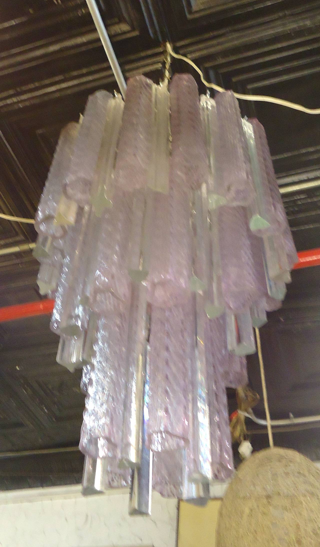 Gorgeous Italian chandelier with colored tube glass and prism glass, cascading down the brass frame. Very unusual purple hue glass.

(Please confirm item location - NY or NJ - with dealer).