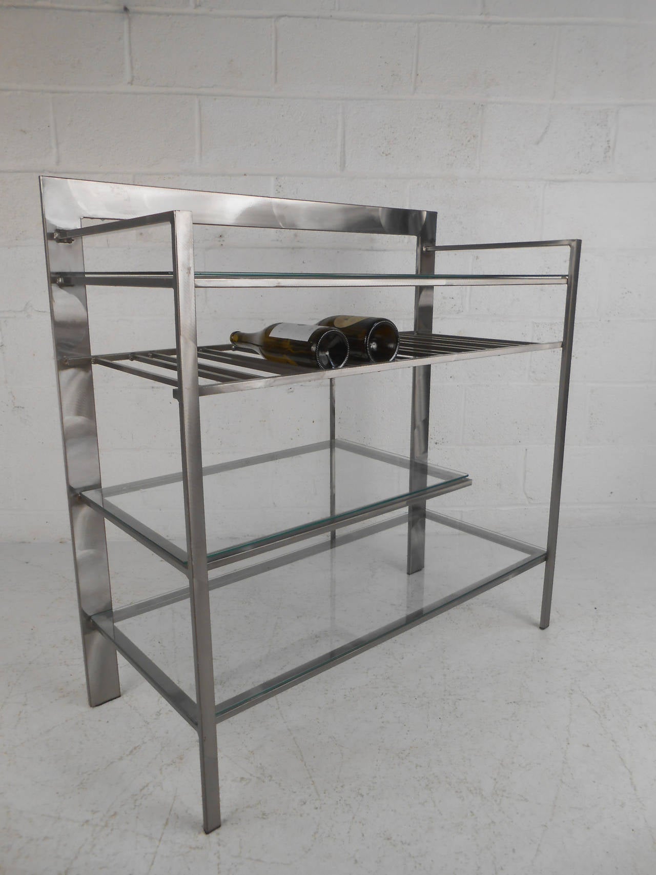 This unique side bar makes a stylish addition to any interior, perfect for storing bottles, glasses, and more. Please confirm item location (NY or NJ).
