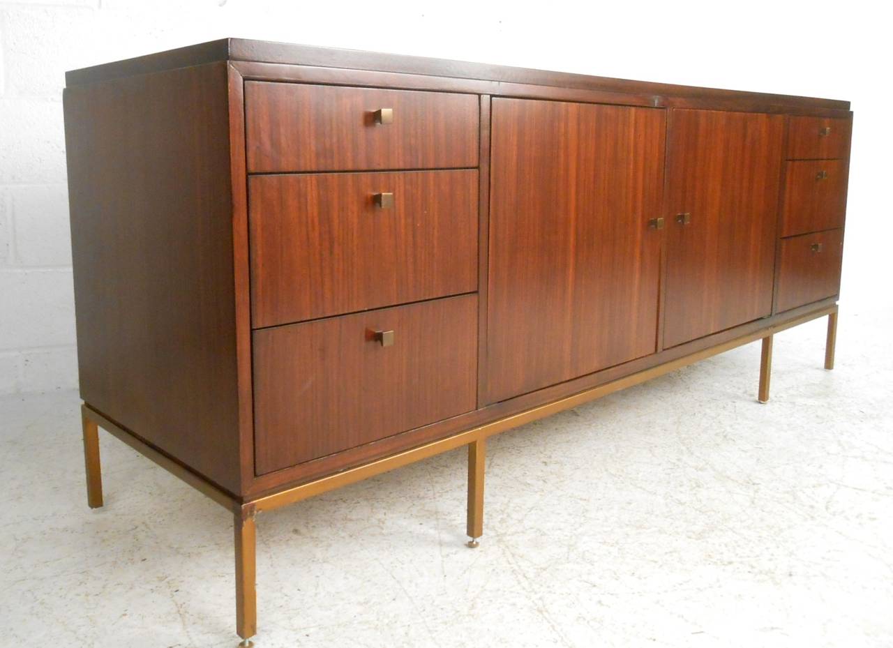 This wonderful mid-century style sideboard offers an impressive area of storage with slatted back panel for running wires for electronics, etc. Stylish option for serving or use as a television console. Please confirm item location (NY or NJ).