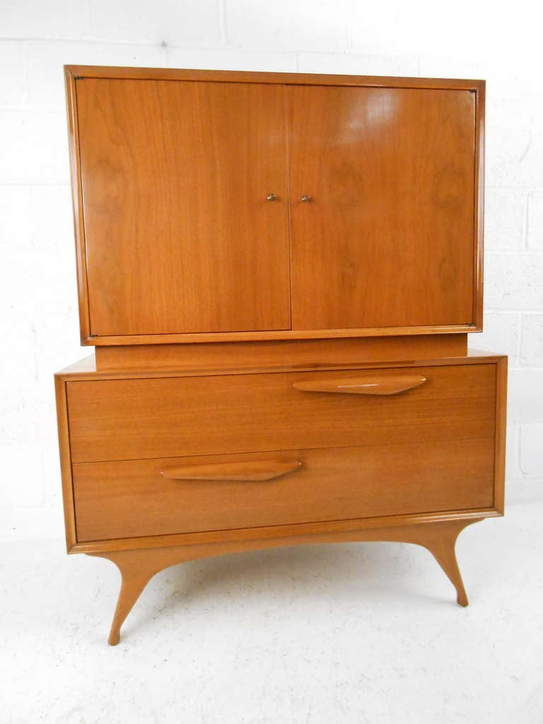 Stylish Mid-Century Modern dresser in walnut. Please confirm item location (NY or NJ) with dealer.