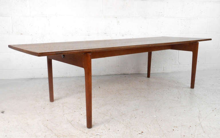 This beautiful Andreas Tuck coffee table features the wonderful design of Hans Wegner. Complete with trademark signet, and makers stamp this piece makes a great addition to home or business. Please confirm item location (NY or NJ).