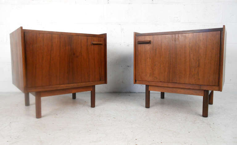 These beautiful end-tables feature carved door pulls, unique rased edges on the top, and  finished backs. The pair both have their original Falster Mobelfabrik and Danish control tags as well. Please confirm item location (NY or NJ).