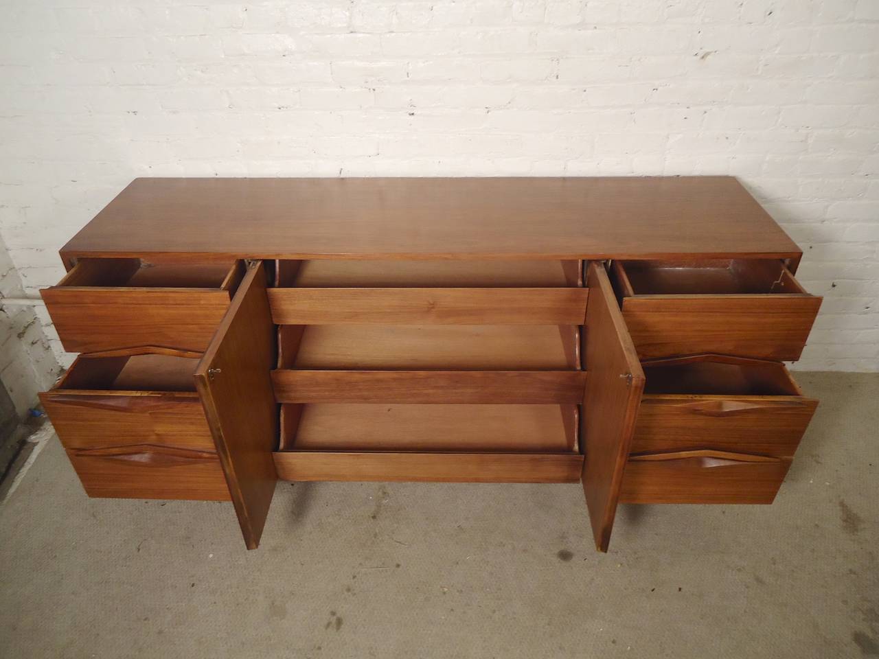 Mid-20th Century Nine-Drawer Mid-Century Sculpted Front Dresser