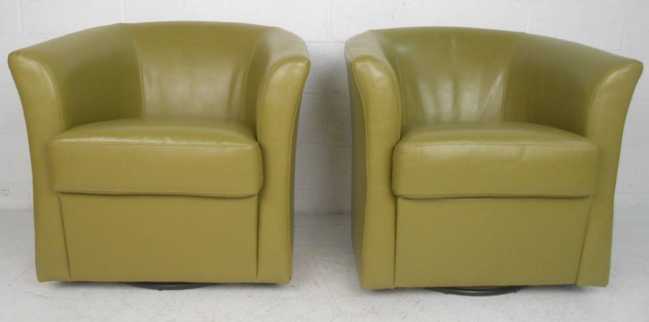 20th Century Pair of Mid Century Style Green Vinyl Swivel Club Chairs