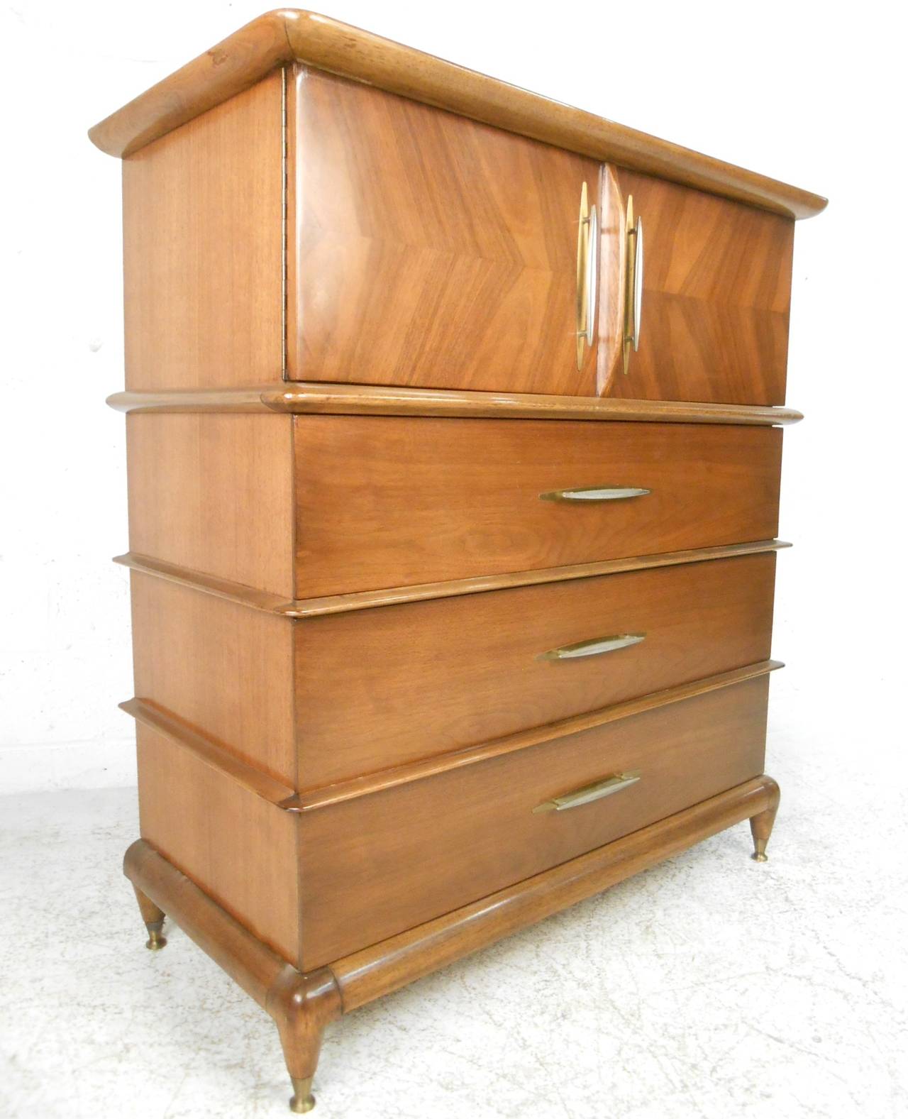 This unique walnut dresser by Kent Coffey is from his line 