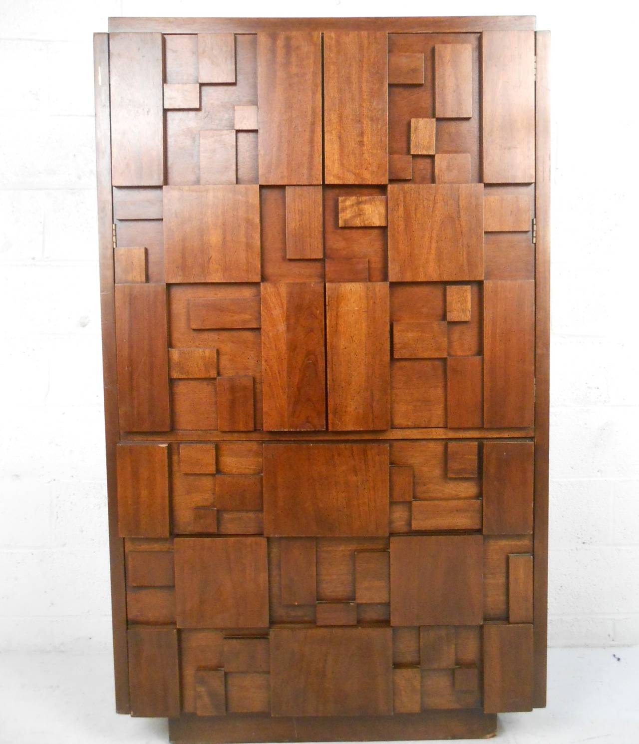 This unique gentleman's chest by Lane furniture features the brutalist mosaic style made popular by Paul Evans. Plenty of storage for any setting, unique cabinet portion features shelf space and extra drawer. Please confirm item location (NY or NJ).
