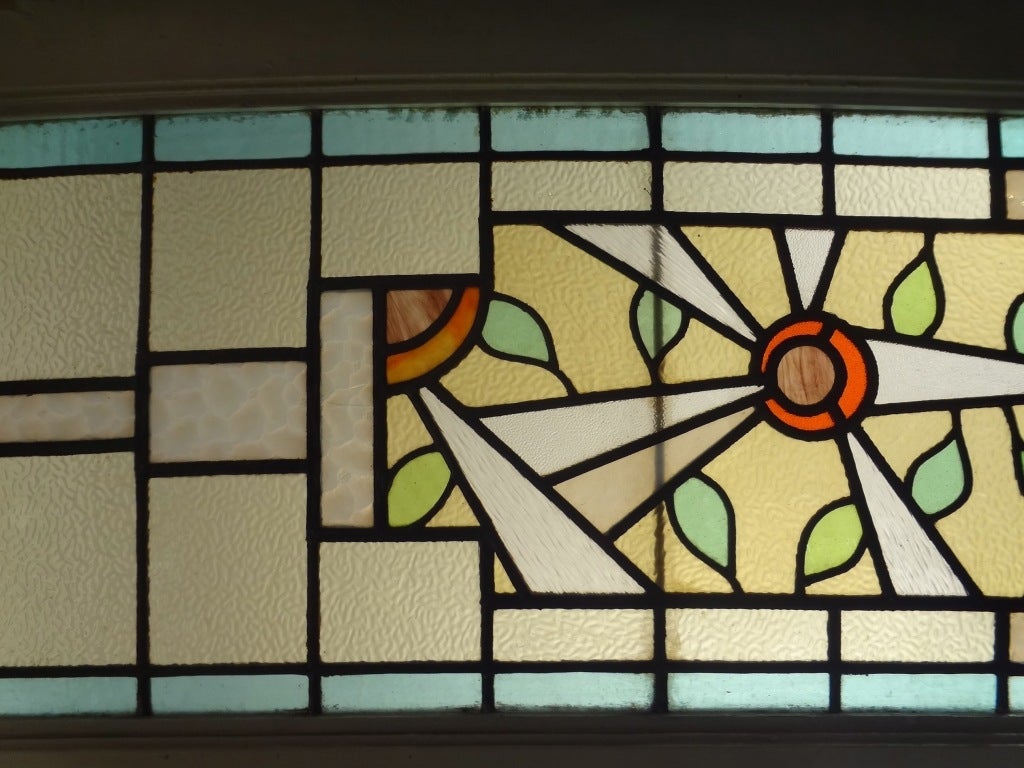 Colorful leaded textured glass window with abstract pattern.