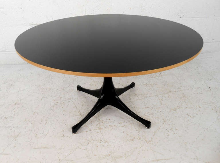 This beautifulmid century modern pedestal table by Herman Miller can be used as a coffee or end table, and features the sleek and simple design of mid-century designer George Nelson. Original manufacturer's label still intact, please confirm item