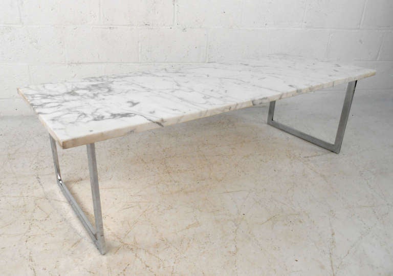 This beautiful marble slab coffee table features a Baughman style chrome base, which wonderfully highlights the beautiful white marble. Please confirm item location (NY or NJ).