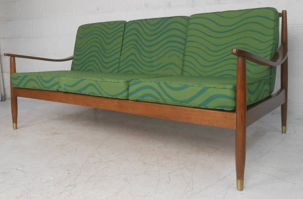 Vintage walnut frame midcentury sofa from the J.B.Van Sciver Co features wood spoke back, strap seats, and vintage green upholstery. Please confirm item location (NY or NJ) with dealer.