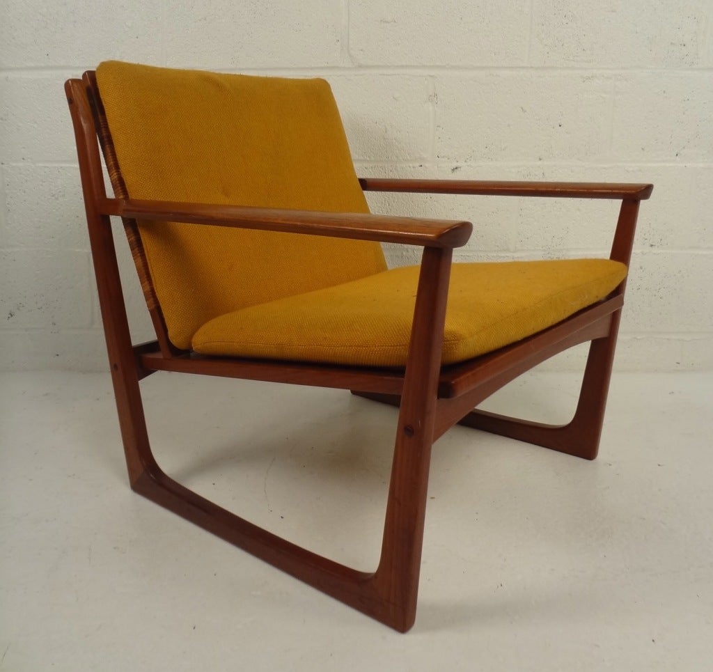 Scandinavian Modern lounge chair by Hans Olsen for Brdr. Juul Kristensen features beautiful teak and cane construction and sled leg design. Please confirm item location (NY or NJ).