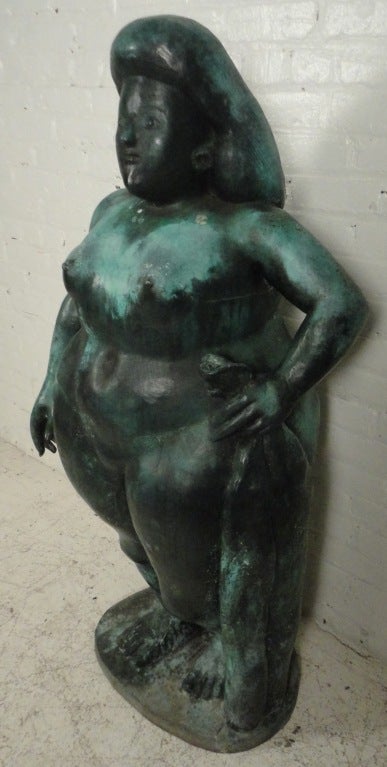 This stylish bronze statue features a lovely patinated finish and shapely Art Deco design. This sculptural nude woman makes an impressive and striking addition to any setting, please confirm item location (NY or NJ).