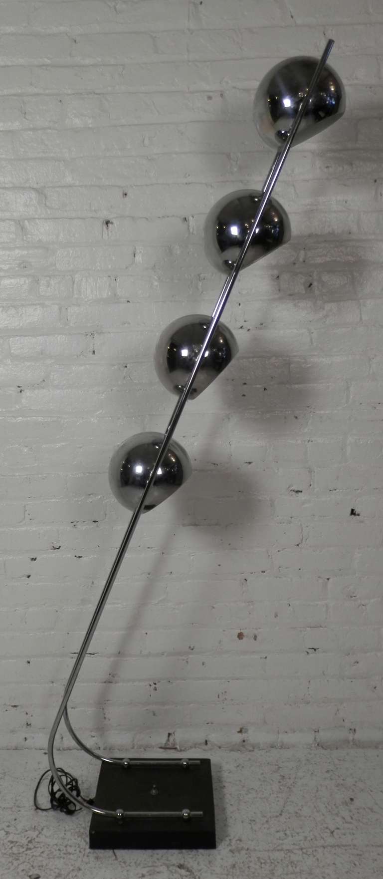 Mid-century modern floor lamp with four eyeball socket shades set upon arching arms. Shades rotate, switch on base.

(Please confirm item location - NY or NJ - with dealer)
