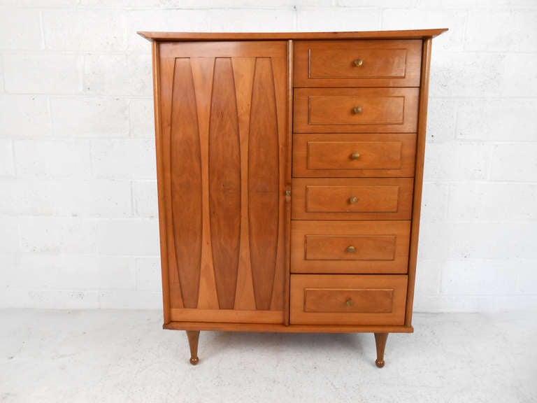 This beautiful storage chest features unique drumstick legs and wonderfully designed cabinet front, making a truly eye-catching solution for bedroom storage. Please confirm item location (NY or NJ).