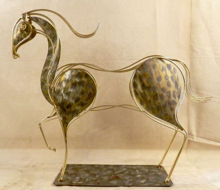 Unique C. Jere prancing horse sculpture. Beautiful flowing lines creates an energetic presence, and with brushed metal accent livens up a table or desk surface.

(Please confirm item location - NY or NJ - with dealer)