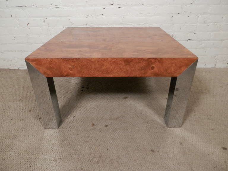 Gorgeous sofa table with thick chrome legs and a knock out top made of book-matching olive burl wood.

(Please confirm item location - NY or NJ - with dealer)