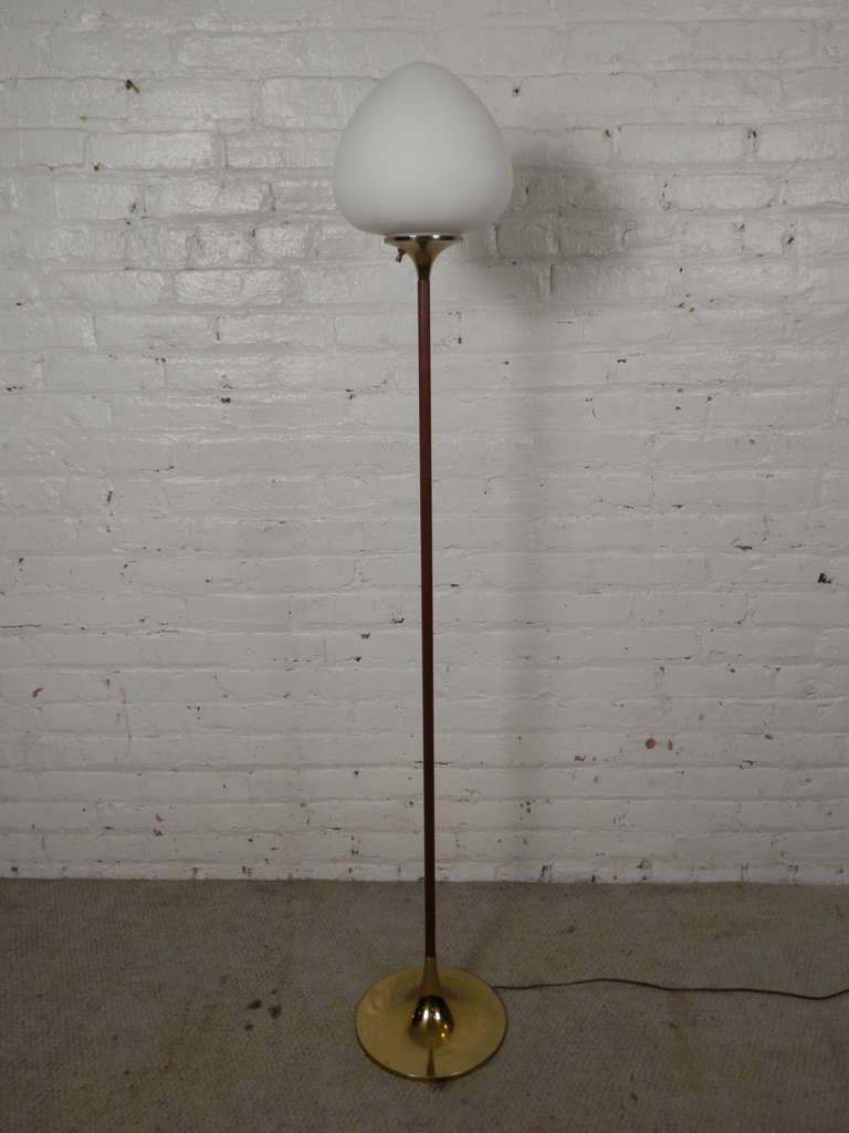 Attractive vintage modern floor lamp by Laurel Lamp Company. Slender teak stem, fluted brass base and topped with a mushroom style satin globe. Original opaque shade give a warm glowing light.

(Please confirm item location - NY or NJ - with