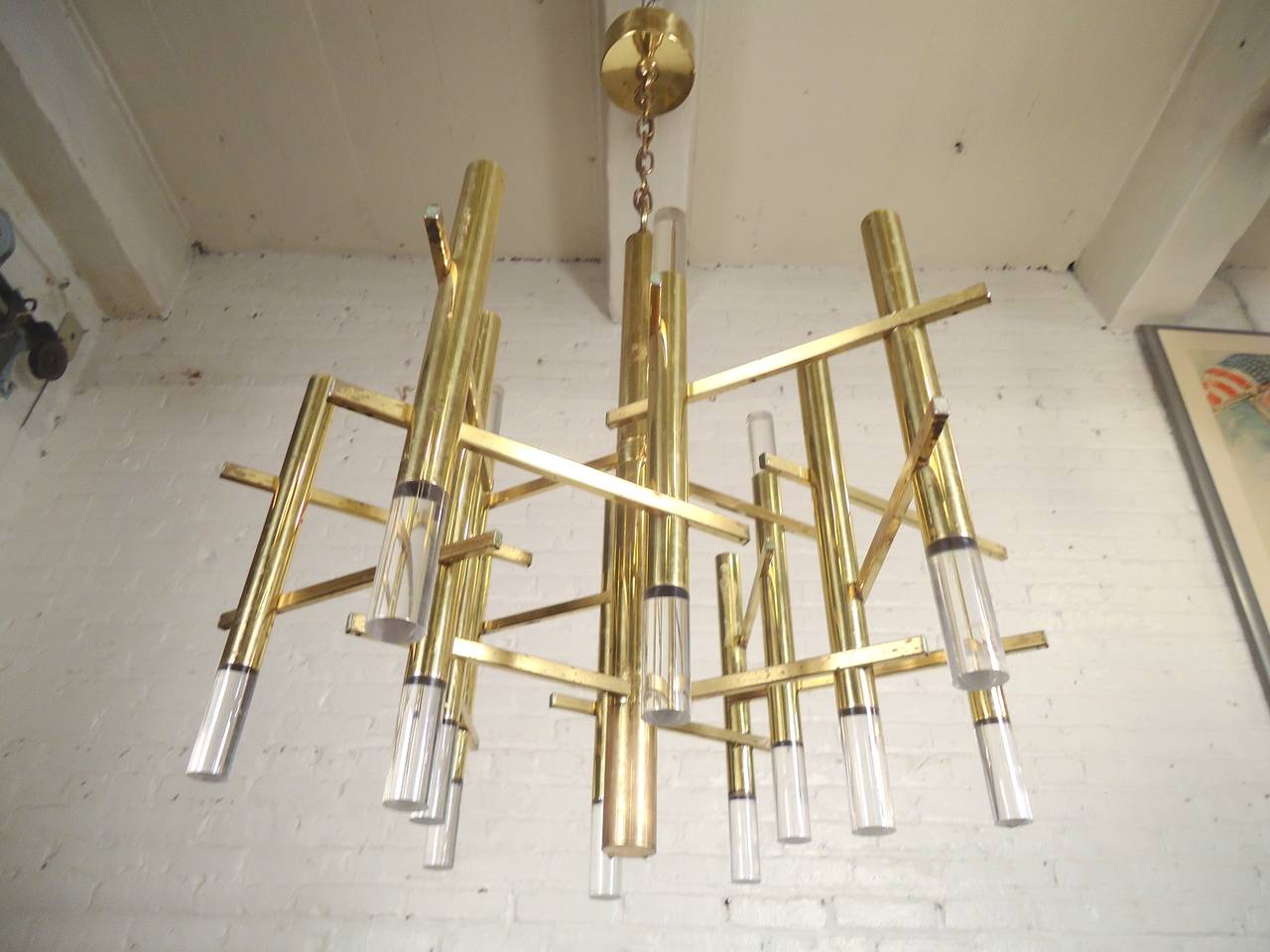 Vintage modern chandelier by Gaetano Sciolari featuring beautifully sculpted brass body and Lucite trim.

(Please confirm item location - NY or NJ - with dealer).