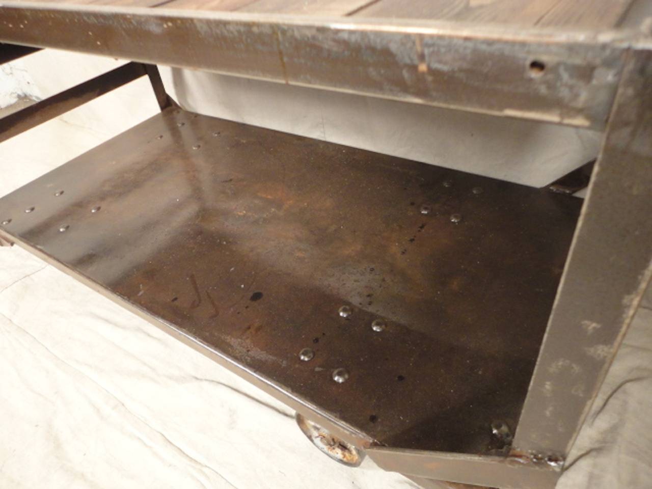 Vintage industrial cart with wood top and metal shelf on large casters. Very unusual and great as a modern shelf, console or bar cart.
Height to top shelf is 27.5".

(Please confirm item location - NY or NJ - with dealer)