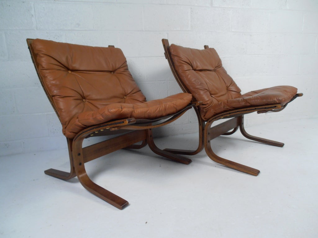 Vintage Danish modern design with leather cushions and bentwood frame.
