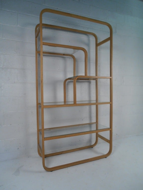 Laminated bentwood etagere with glass shelves.