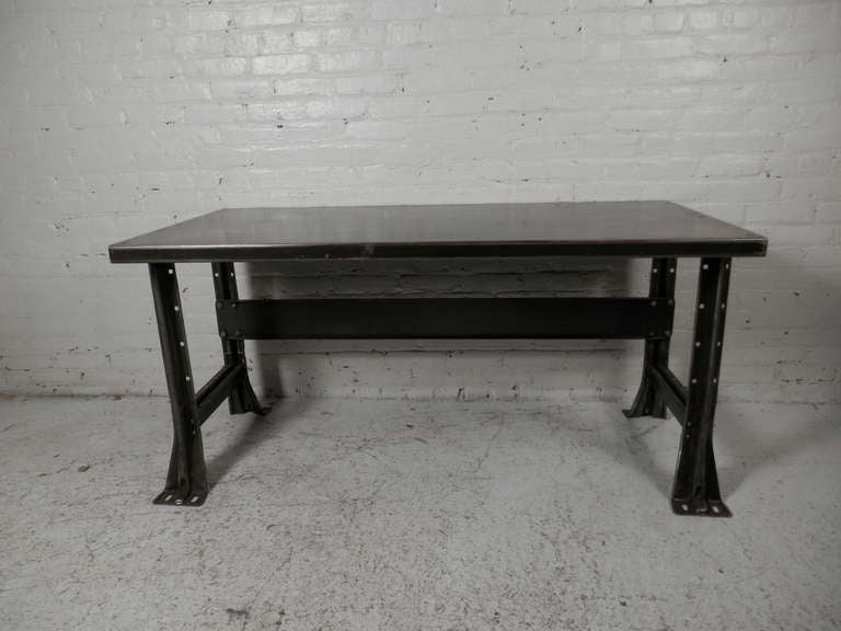 Solid iron metal work table. Newly re-finished and lacquered for a handsome machine age look. Usable as a desk or work station.

(Please confirm item location - NY or NJ - with dealer)