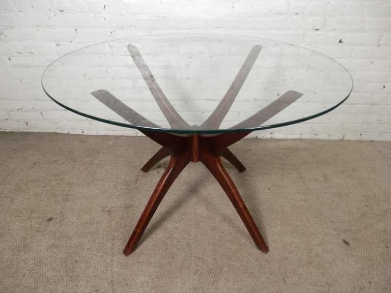 Rare dining table designed for Craft Associates by Adrian Pearsall. Round glass top resting on his classic 