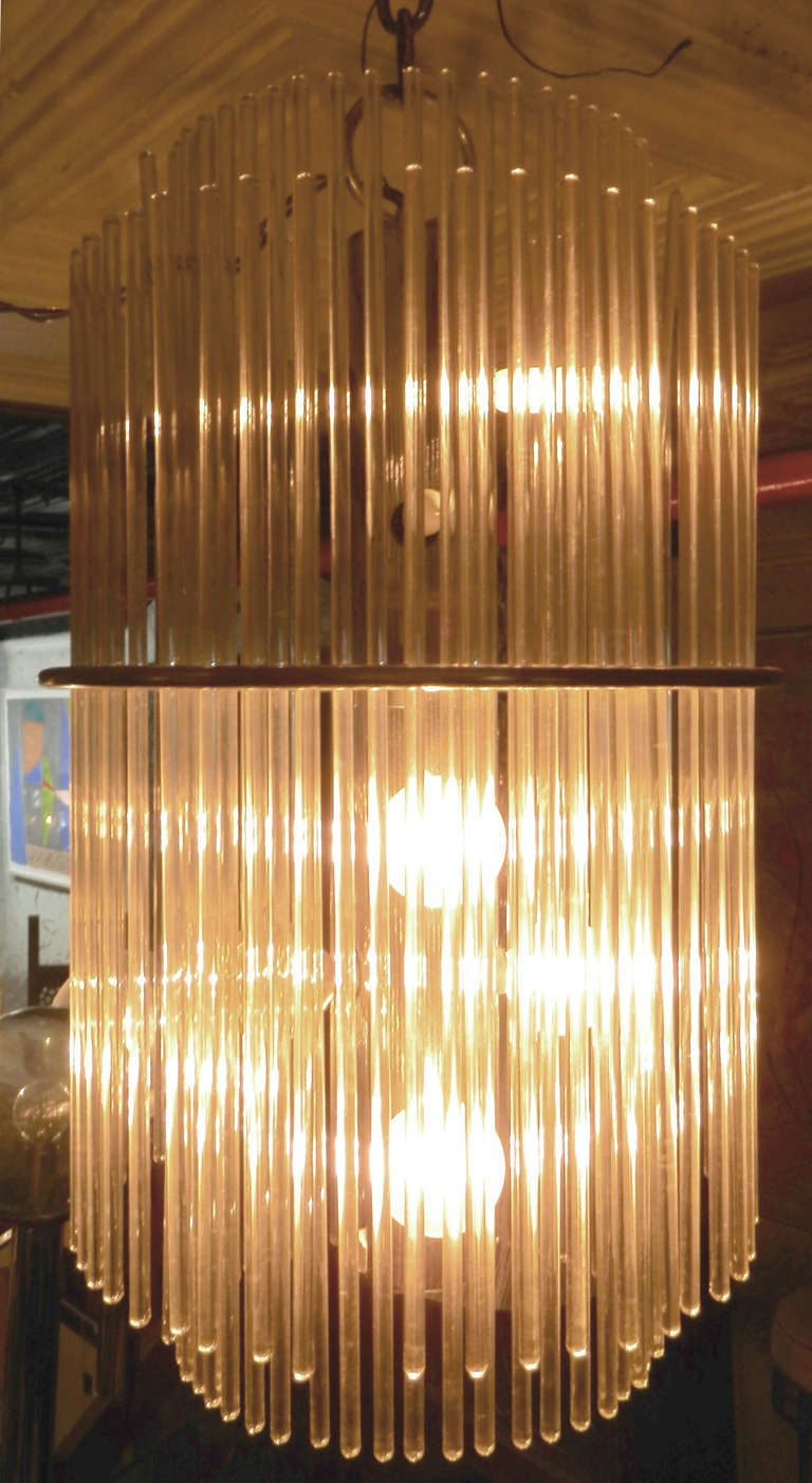 Beautiful Mid-Century Modern chandelier by Lightolier. Comprised of glass rods in two levels creating an elegant cascading effect. Pierced nickel plated frame with delicate glass rods.

(Please confirm item location - NY or NJ - with dealer)