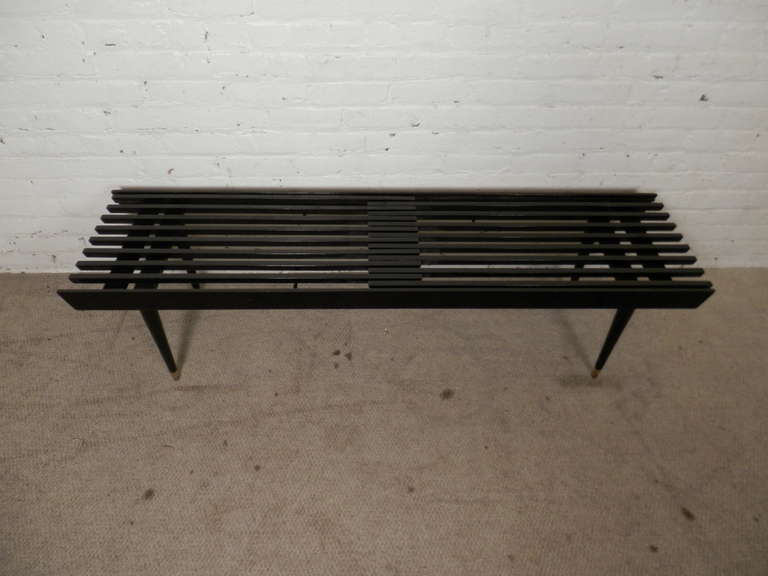 Mid-Century Modern ebony bench/coffee table with moving slats and cone legs. Works well as a living room table or bench.

(Please confirm item location - NY or NJ - with dealer)