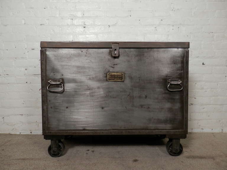 Unique heavy metal rolling trunk from 1944, features brass 
