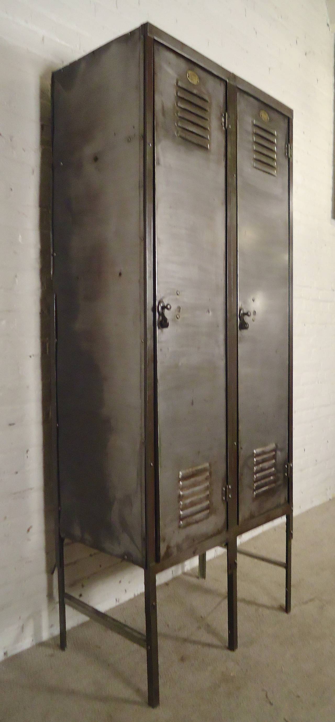 Vintage double locker unit restored, featuring large and deep storage space, original brass tags, set on metal legs. Makes for an attractive cabinet in a modern home or office.

(Please confirm item location - NY or NJ - with dealer)