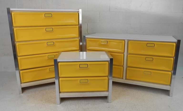 Vintage 70s retro-style dressers with pop yellow drawer fronts, white laminate tops, and aluminum accent trim. Please confirm item location (NY or NJ) with dealer.