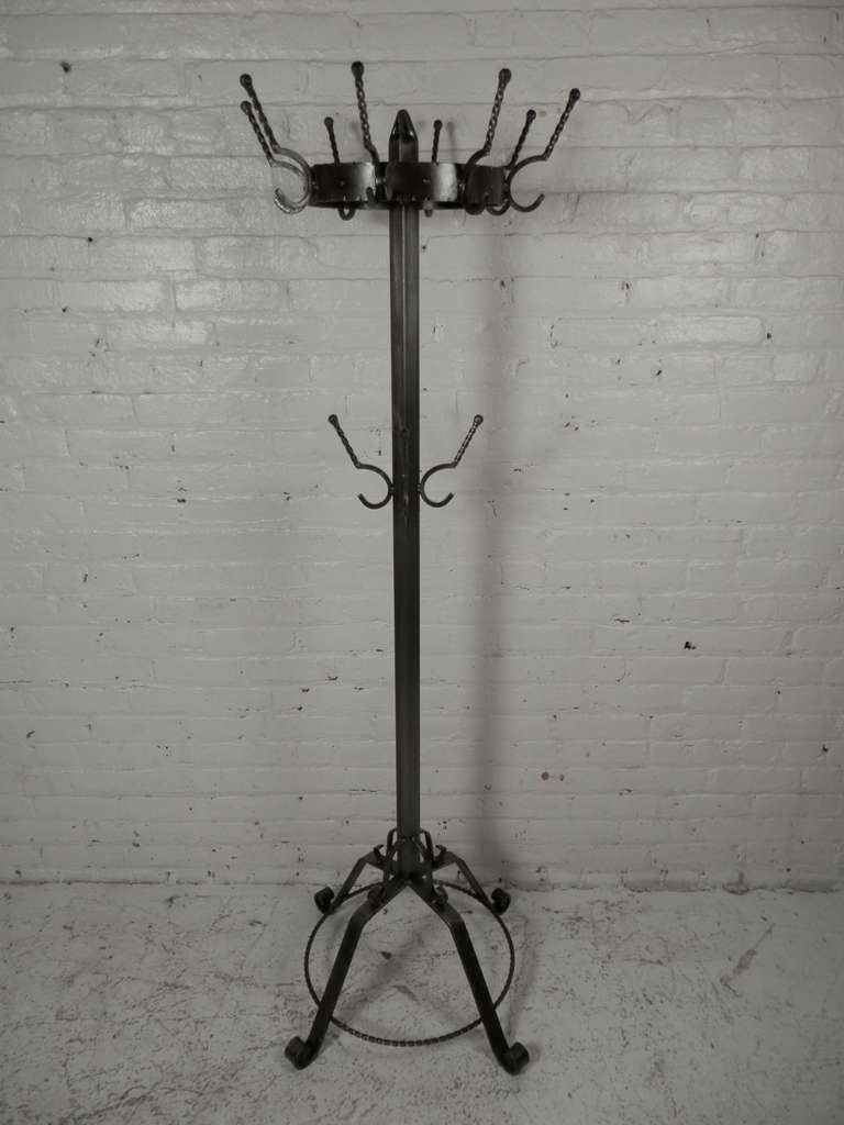 Industrial metal standing coat rack with twelve twisted double hooks. Heavy duty solid construction.

(Please confirm item location - NY or NJ - with dealer)
