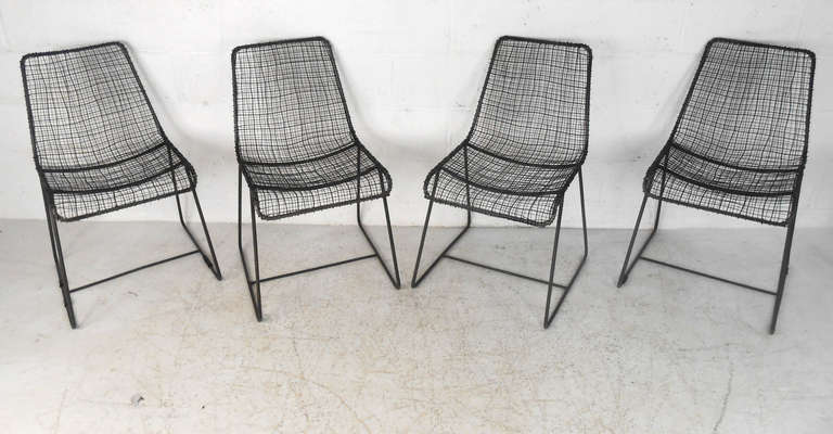 This set of five industrial mesh seats can be used either indoors or out, and offer a wonderful mix of vintage design and comfort. Uniquely styled this set is perfect for home or business seating. Please confirm item location (NY or NJ).