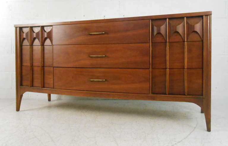With stylish lines, unique drawer pulls, and classic vintage American style this beautiful 1950's Kent Coffey Perspecta nine drawer dresser is perfect for use in any mid-century home. Please confirm item location (NY or NJ).