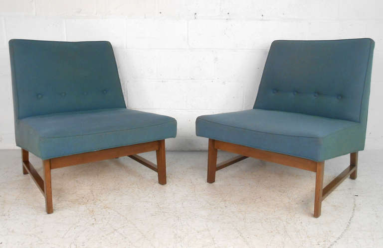 These beautifully designed Roger Sprunger for Dunbar, circa 1960s model # 127 lounge chairs offer stylish and spacious seating for home or business. Simple lines and button tufting make this matching pair a wonderful find! Please confirm item
