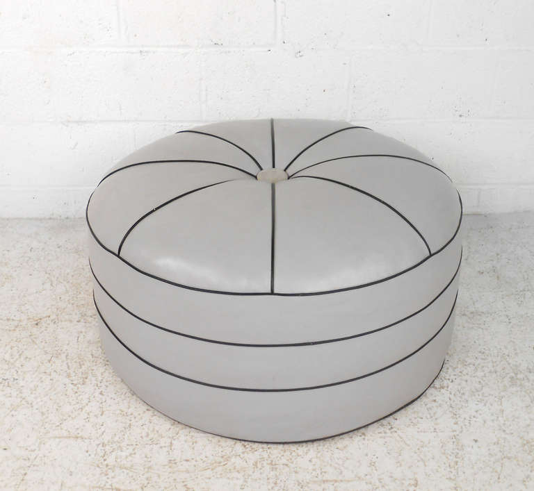 This wonderful vintage pouf style ottoman combines unique design, button tufted upholstery, and wonderful construction. Comfortably stuffed, perfect for any designer living space.  Please confirm item location (NY or NJ).