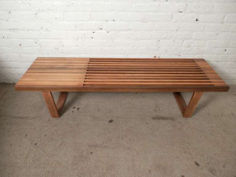 Newly refinished slat bench designed in the style of George Nelson. Perfect for extra seating or as a sofa coffee table. Great blonde multi-coloring almost gives an attractive butcher block look.

(Please confirm item location - NY or NJ - with