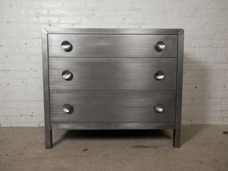 Three-drawer bedroom dresser designed by Norman Bel Geddes for Simmons. This is his classic style with rounded edges, large 