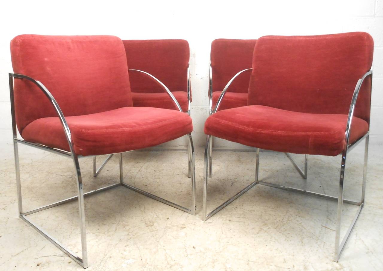 This set of four Milo Baughman dining chairs offers the heavy chrome construction and style midcentury Thayer Coggin was so well-known for. Rounded chrome armrests and comfortable upholstery make these a great set for any interior. Please confirm