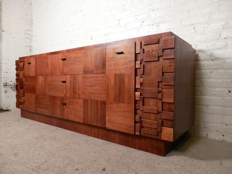 Amazing geometric pattern of squares and oblongs standing out in bold relief for a striking three-dimensional facade, in addition to walnut grain in miss-matched patterns. Designed by Lane Furniture in the 1970s for their 