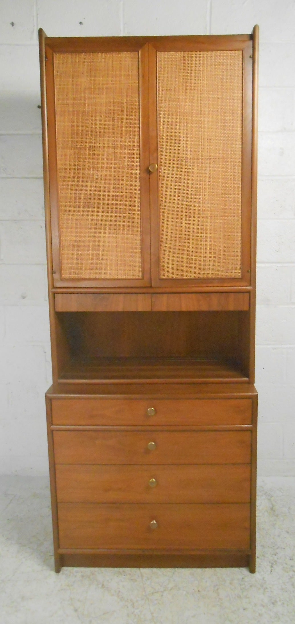 Beautiful Mid-Century two-piece walnut server by Drexel. Woven cane covered doors, adjustable shelves and six drawers provide ample storage options. Please confirm item location (NY or NJ) with dealer.