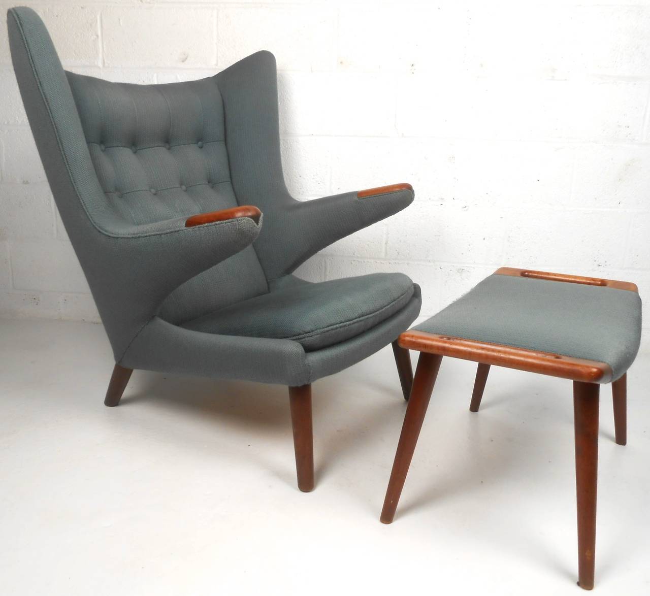 This matching Wegner chair and ottoman are a must have for any Mid-Century enthusiast. This widely celebrated design (AP19) by AP Stolen dates back to the 1950s and combines comfort and style in a truly unique fashion. Please confirm item location
