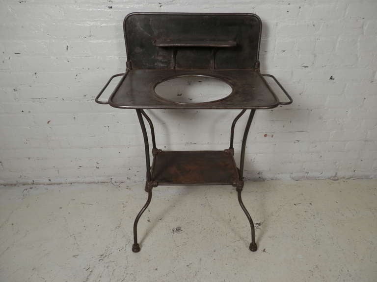 Unique vintage wash stand. Has been re-finished and striped to bare metal and lacquered. Originally used in a military field hospital or farmhouse.

(Please confirm item location - NY or NJ - with dealer)