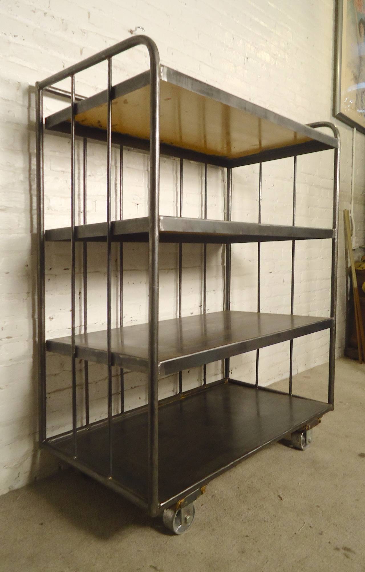 Very large and very heavy rolling cart with four wide shelves. Stripped down and lacquered for a fresh industrial look. Makes for a great bookcase.

(Please confirm item location - NY or NJ - with dealer)
